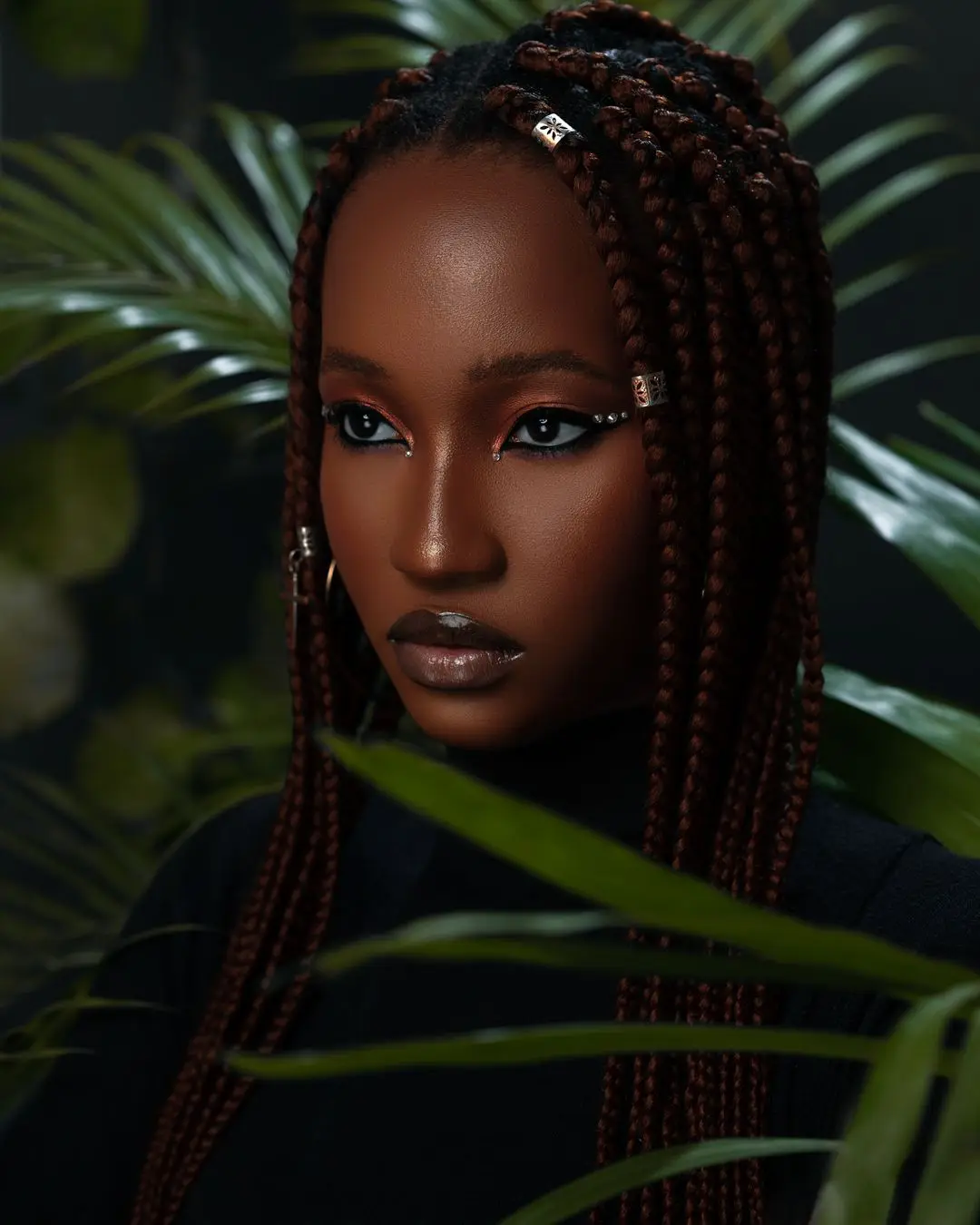 Portrait d’une femme coiffée de box braids